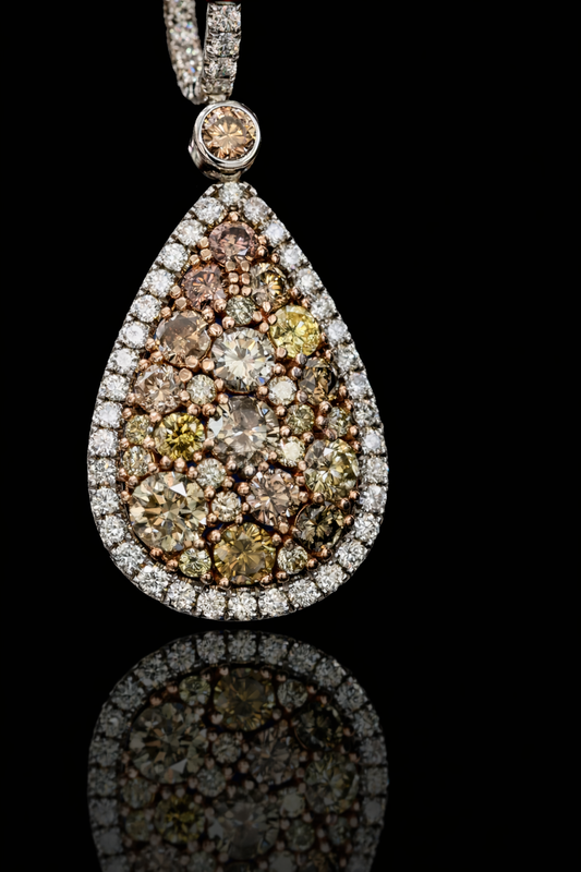 Fancy yellow diamond teardrop halo drop earrings in 14K white gold with 5.49CT VS–SI natural colored diamonds – luxury Houston fine jewelry by Endless Diamonds.